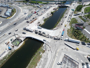 Aerial view of the NW 79 Avenue Bridge, with travel lanes operating on the west side of the bridge while the east side is used for widening work.